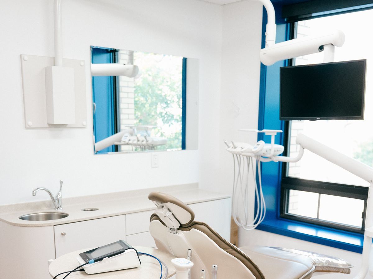 Patient chair with a wall-mounted TV at Norwood Dental Centre