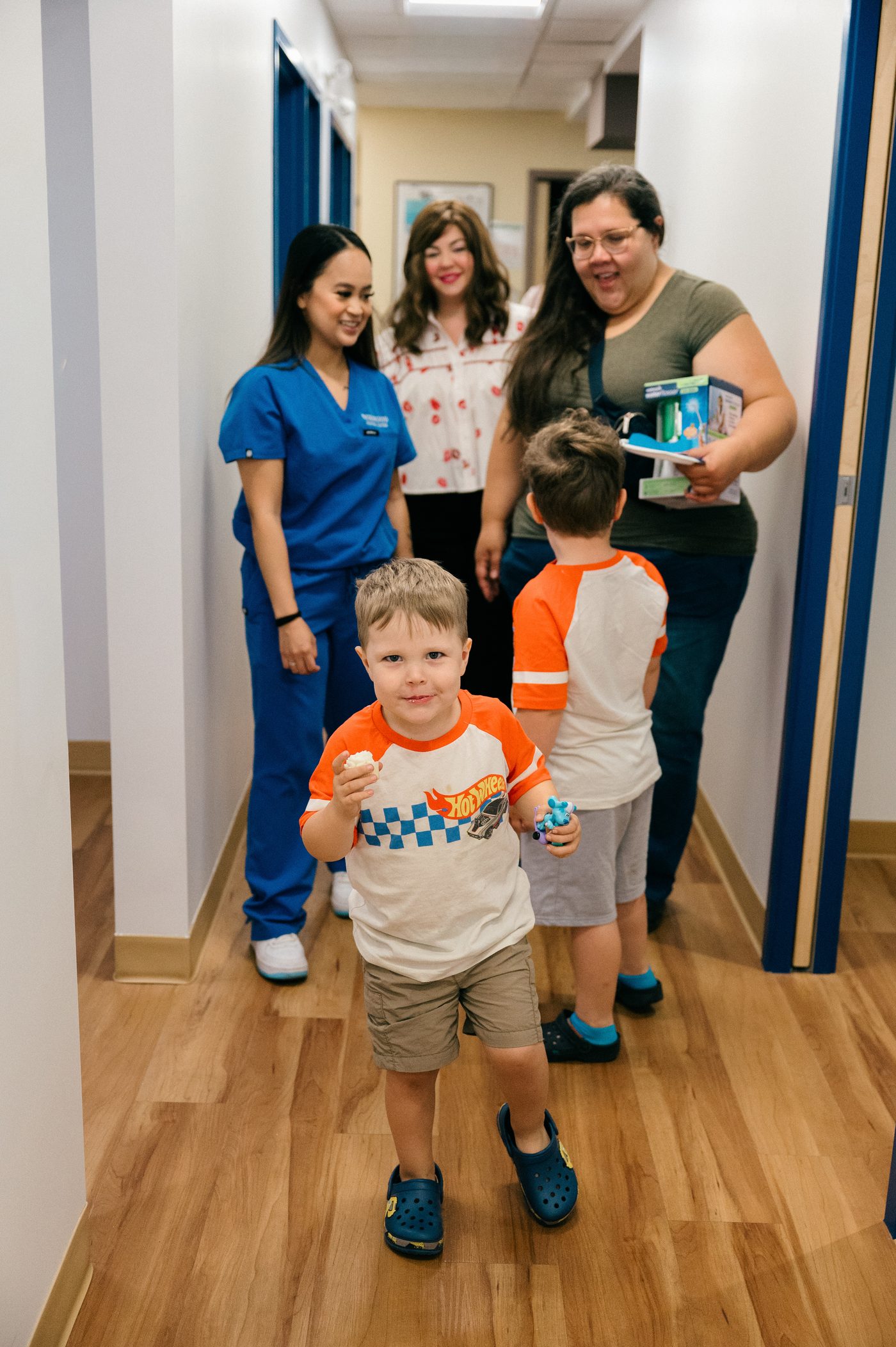 Kids leaving a Norwood Dental Centre open house with goody bags and treats